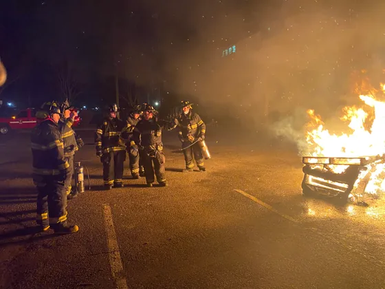 Woodland members working a nighttime fire