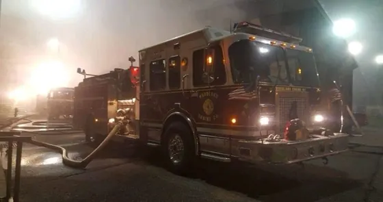 Woodland Engine 4 operating at a nighttime fire